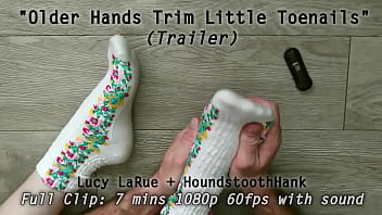 Older hands trim little toenails