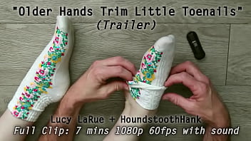 Older hands trim little toenails