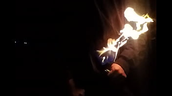 Stroking on fire at night