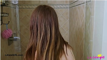 Shy brunette model enjoys a sensual bath