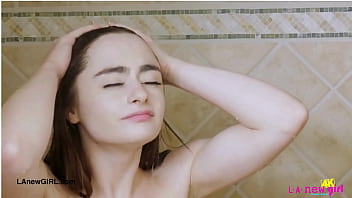 Shy brunette model enjoys a sensual bath