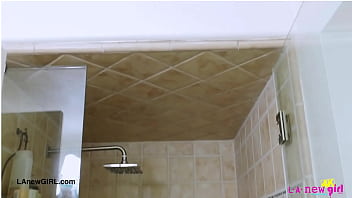 Shy brunette model enjoys a sensual bath