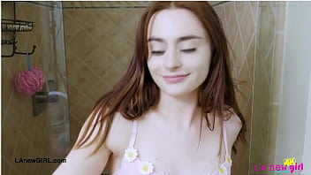 Shy brunette model enjoys a sensual bath