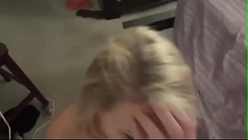 Blonde slut with fake big tits blowing till a facial