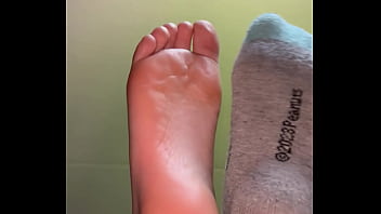 Girl feet sock removal