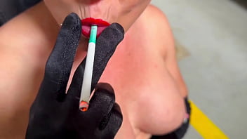 Smoking in red lipstick and satin gloves
