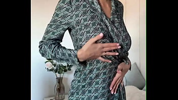 The beauty got excited while calling a friend and started masturbating with her fingers