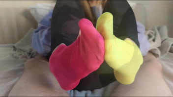 Sockjob in brightly colored mismatched socks