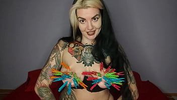 Tattooed kinky girl hangs the maximum number of clothespins on her big tits