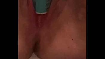 Young girl moans while fucking herself