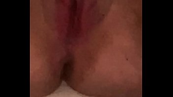 Young girl moans while fucking herself