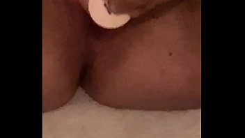 Young girl moans while fucking herself