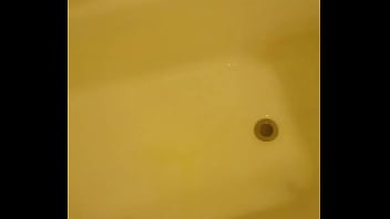 Urinating unto the bathtub