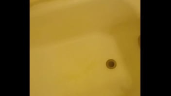 Urinating unto the bathtub
