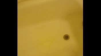 Urinating unto the bathtub