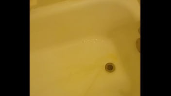 Urinating unto the bathtub