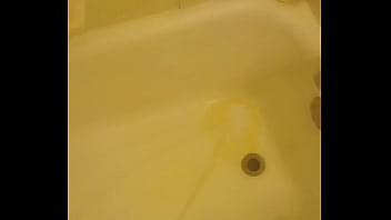 Urinating unto the bathtub