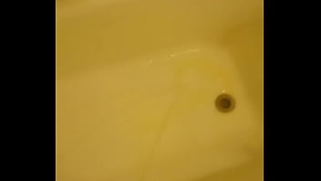Urinating unto the bathtub
