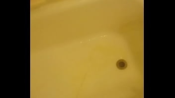 Urinating unto the bathtub