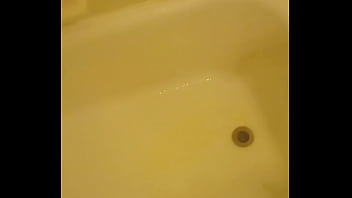 Urinating unto the bathtub