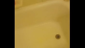 Urinating unto the bathtub