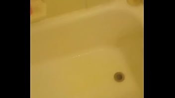 Urinating unto the bathtub
