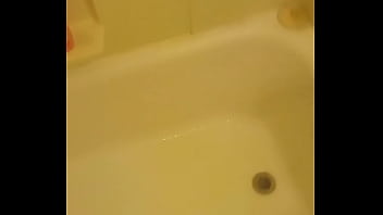 Urinating unto the bathtub