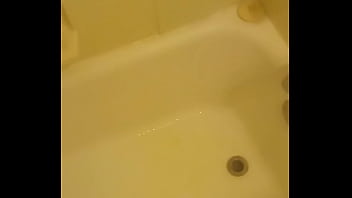 Urinating unto the bathtub