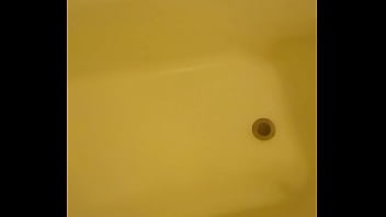 Urinating unto the bathtub