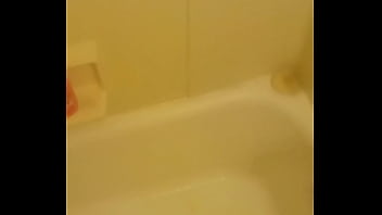 Urinating unto the bathtub