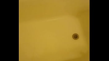 Urinating unto the bathtub