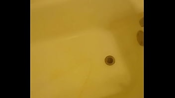 Urinating unto the bathtub