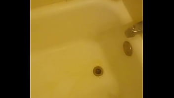 Urinating unto the bathtub