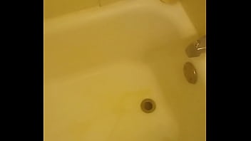 Urinating unto the bathtub