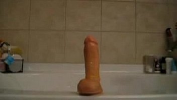 Hot babe fucks her asshole with a dildo