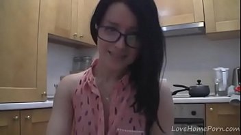 Splendid teen with glasses chatting in the kitchen