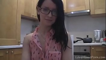 Splendid teen with glasses chatting in the kitchen