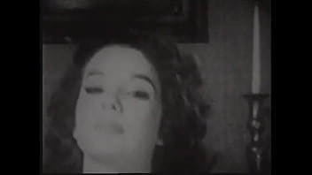 Gorgeous brunette woman in old fashioned lingerie posing in front of the photographer