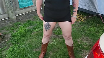 Trashy milf slut pees on the grass in front of other campers at the beach