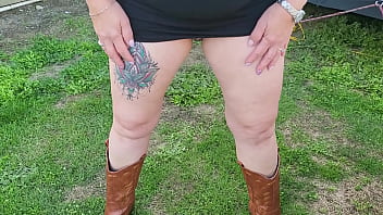 Trashy milf slut pees on the grass in front of other campers at the beach