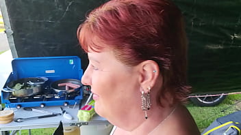 Trashy milf slut pees on the grass in front of other campers at the beach