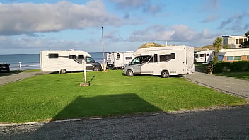 Trashy milf slut pees on the grass in front of other campers at the beach Trashy milf slut pees on the grass in front of other campers at the beach