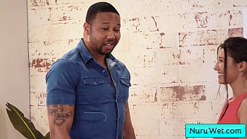 Lusty teenager masseuse rub her naked wet body covered in nuru gel on her black customer