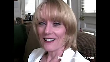 Older busty blonde sucking cock