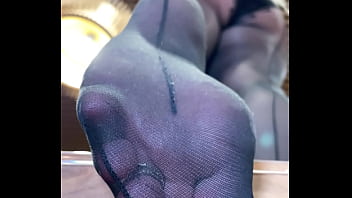 Nylon soles and toes closeup teasing Nylon soles and toes closeup teasing