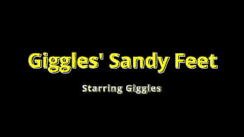 Giggles' feet love rubbing all over a giant hot rock at the beach on beat2feetcom