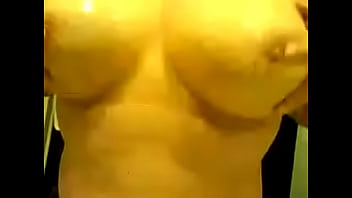 Mature playing with her tits