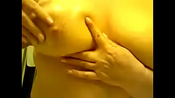 Mature playing with her tits