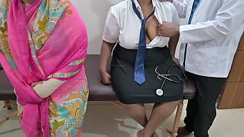 Mom watches doctor checking in clinic Mom watches doctor checking in clinic