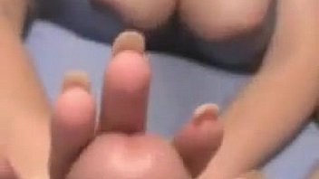 Busty chick gives a handjob point of view